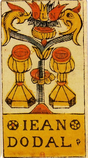 Two golden cups flank an ornamental stem beneath paired creatures. The maker’s name, Jean Dodal, appears below.